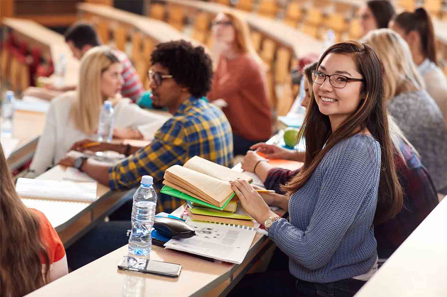 Studying french. Счастливые студенты в столовой. Classroom with students standing.